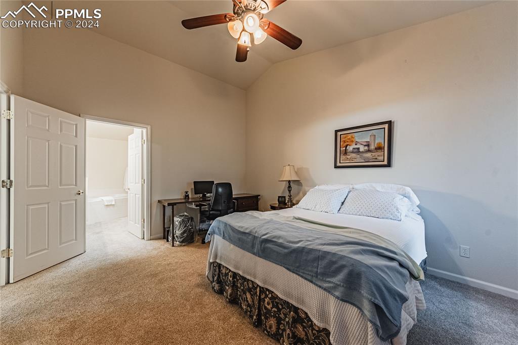 5148 Peak Villa Heights Colorado Springs, CO 80917 - Photo 17 of 45 Primary bedroom with en-suite bathroom