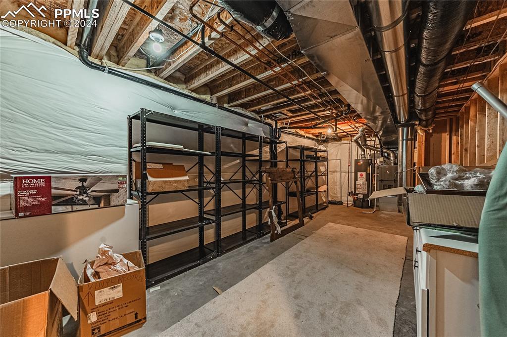 5148 Peak Villa Heights Colorado Springs, CO 80917 - Photo 37 of 45 Plenty of basement storage. Shelving and cabinets included