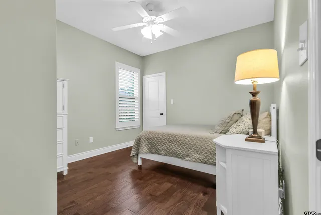 a room with a bed and a chandelier