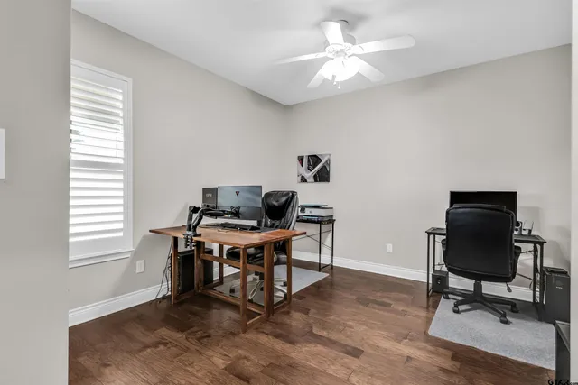 a workspace with furniture and a window