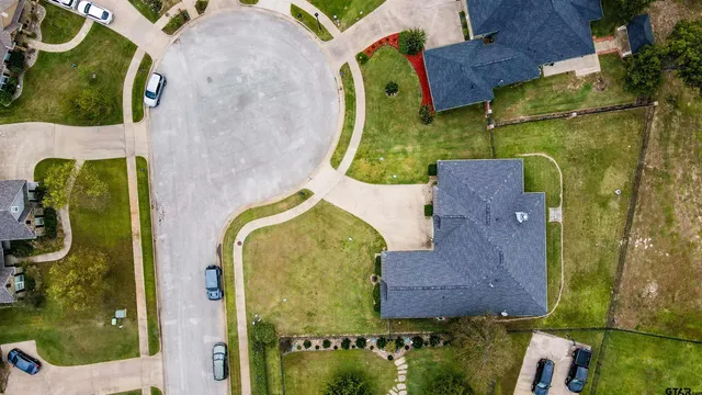 an aerial view of a house with a swimming pool