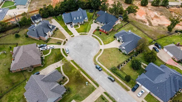 an aerial view of a house with outdoor space