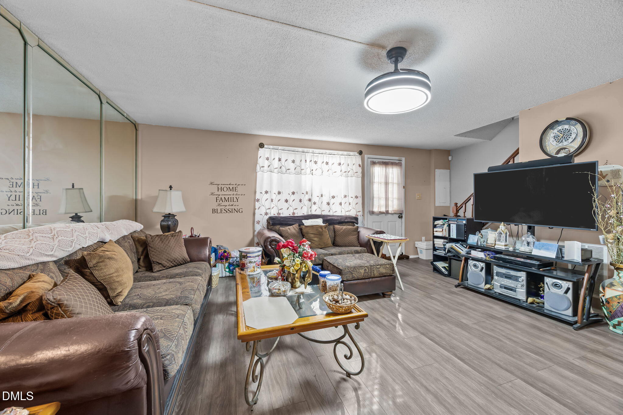 7740 Sandra Lane Raleigh, NC 27615 - Photo 11 of 36 a living room with furniture and a flat screen tv