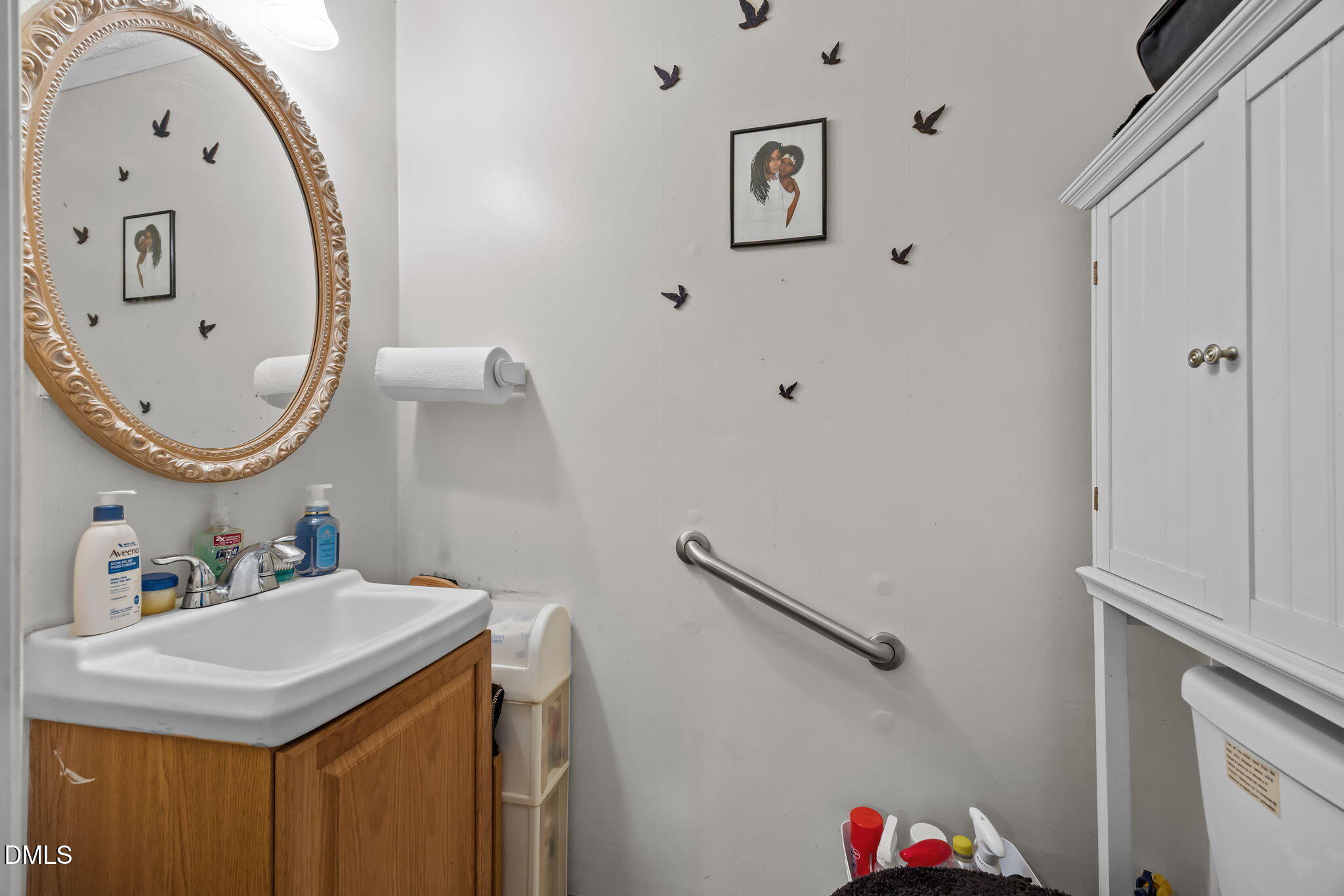 7740 Sandra Lane Raleigh, NC 27615 - Photo 12 of 36 a bathroom with a sink and a mirror