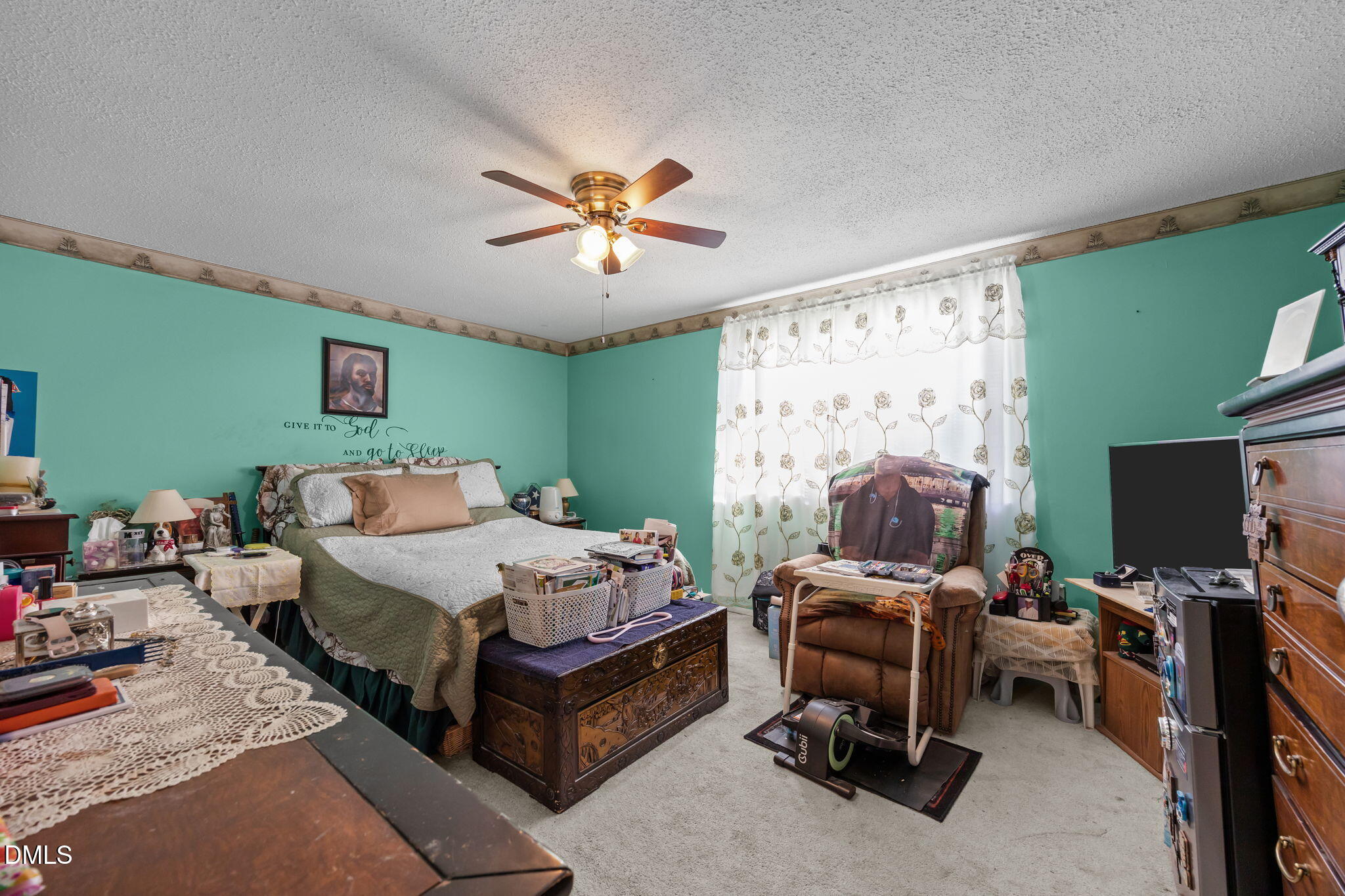 7740 Sandra Lane Raleigh, NC 27615 - Photo 13 of 36 a bedroom with a bed and a flat screen tv