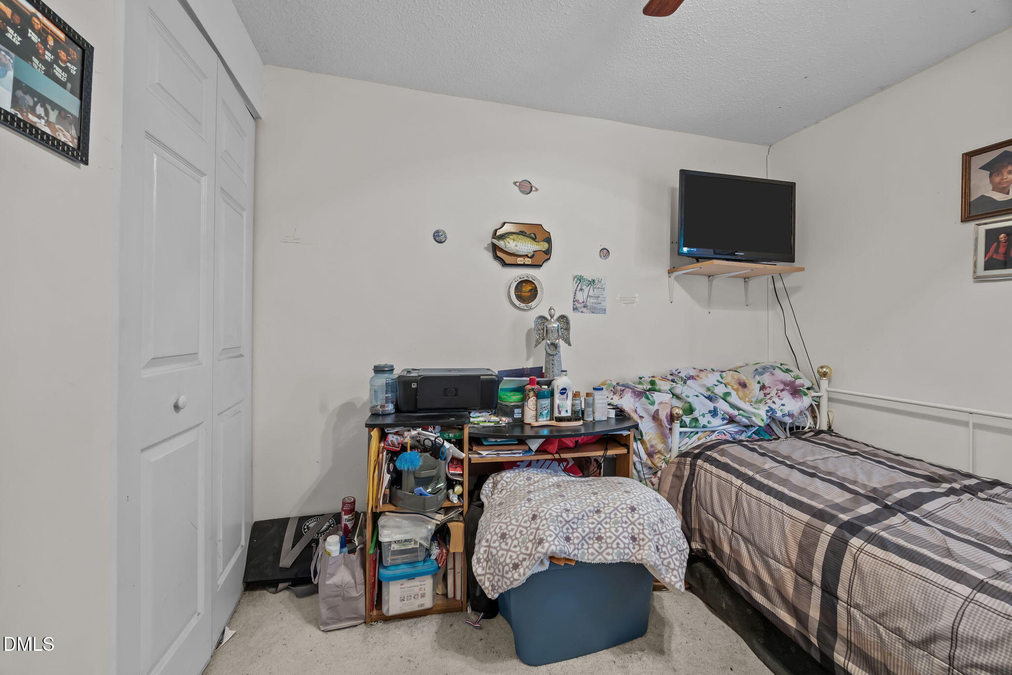 7740 Sandra Lane Raleigh, NC 27615 - Photo 20 of 36 a bedroom with bed and tv