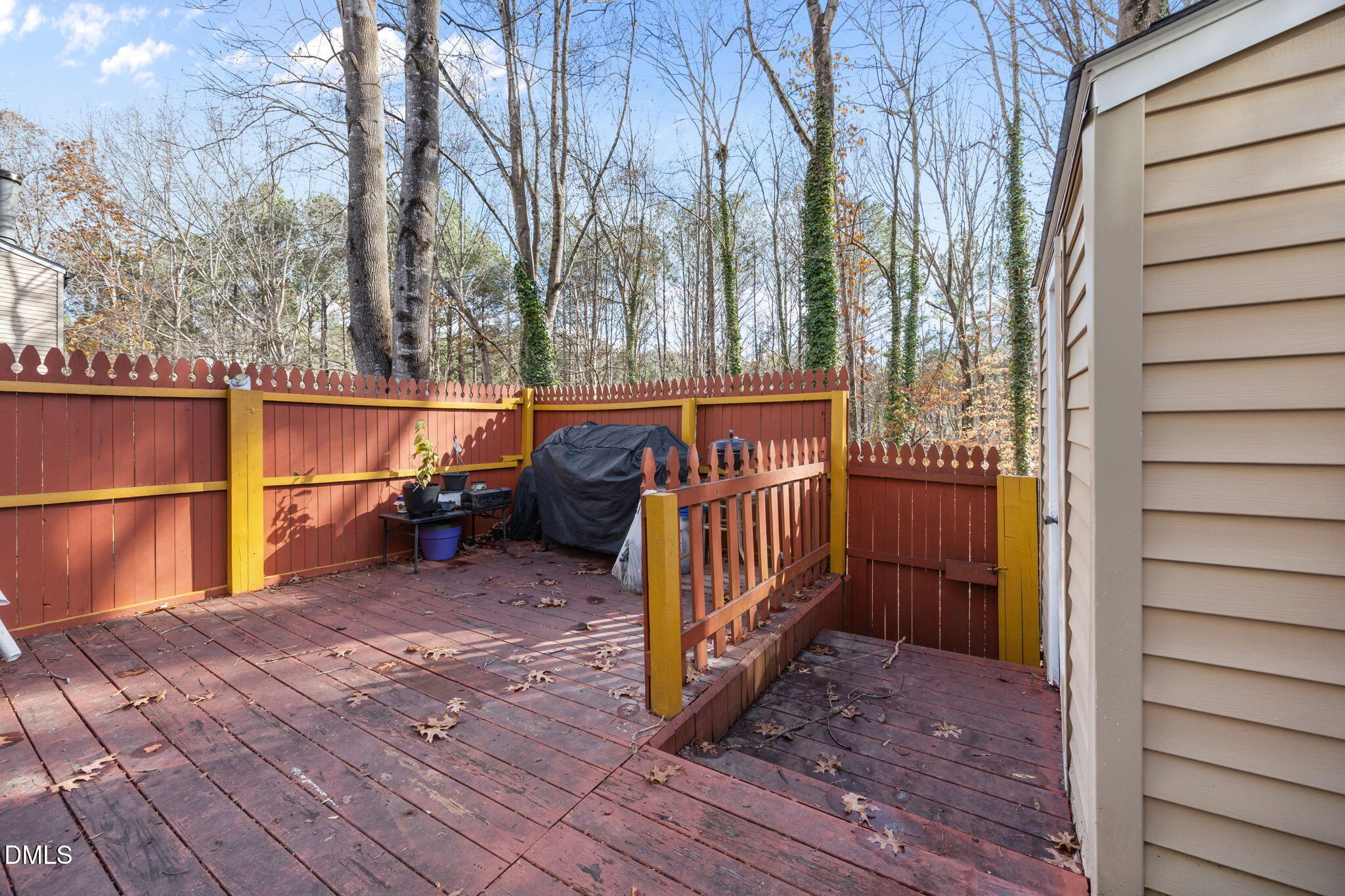 7740 Sandra Lane Raleigh, NC 27615 - Photo 23 of 36 a view of a deck with wooden floor and fence