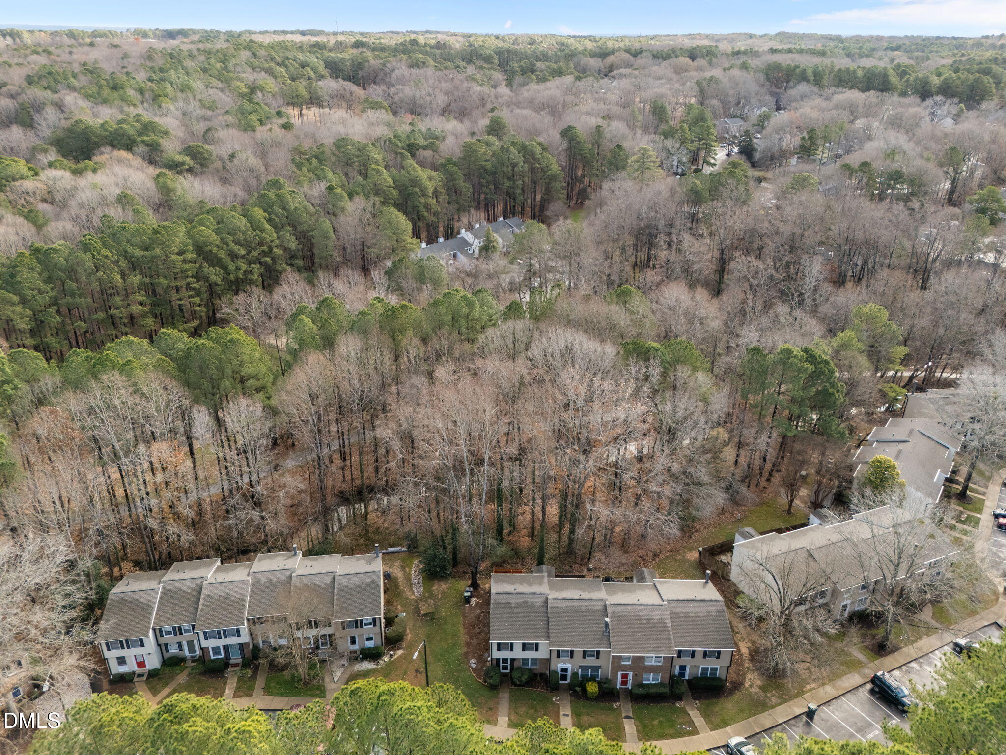 7740 Sandra Lane Raleigh, NC 27615 - Photo 28 of 36 an aerial view of a house with a garden and trees