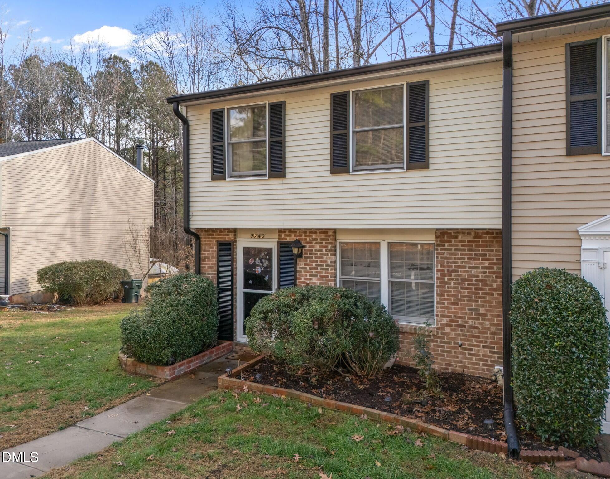 7740 Sandra Lane Raleigh, NC 27615 - Photo 33 of 36 a view of a house with a yard