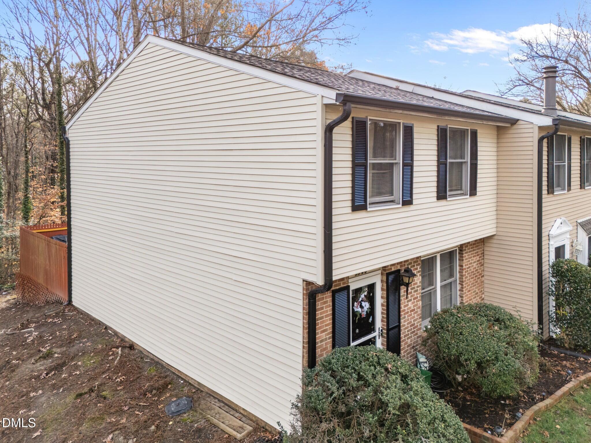 7740 Sandra Lane Raleigh, NC 27615 - Photo 34 of 36 a view of a white house with many windows