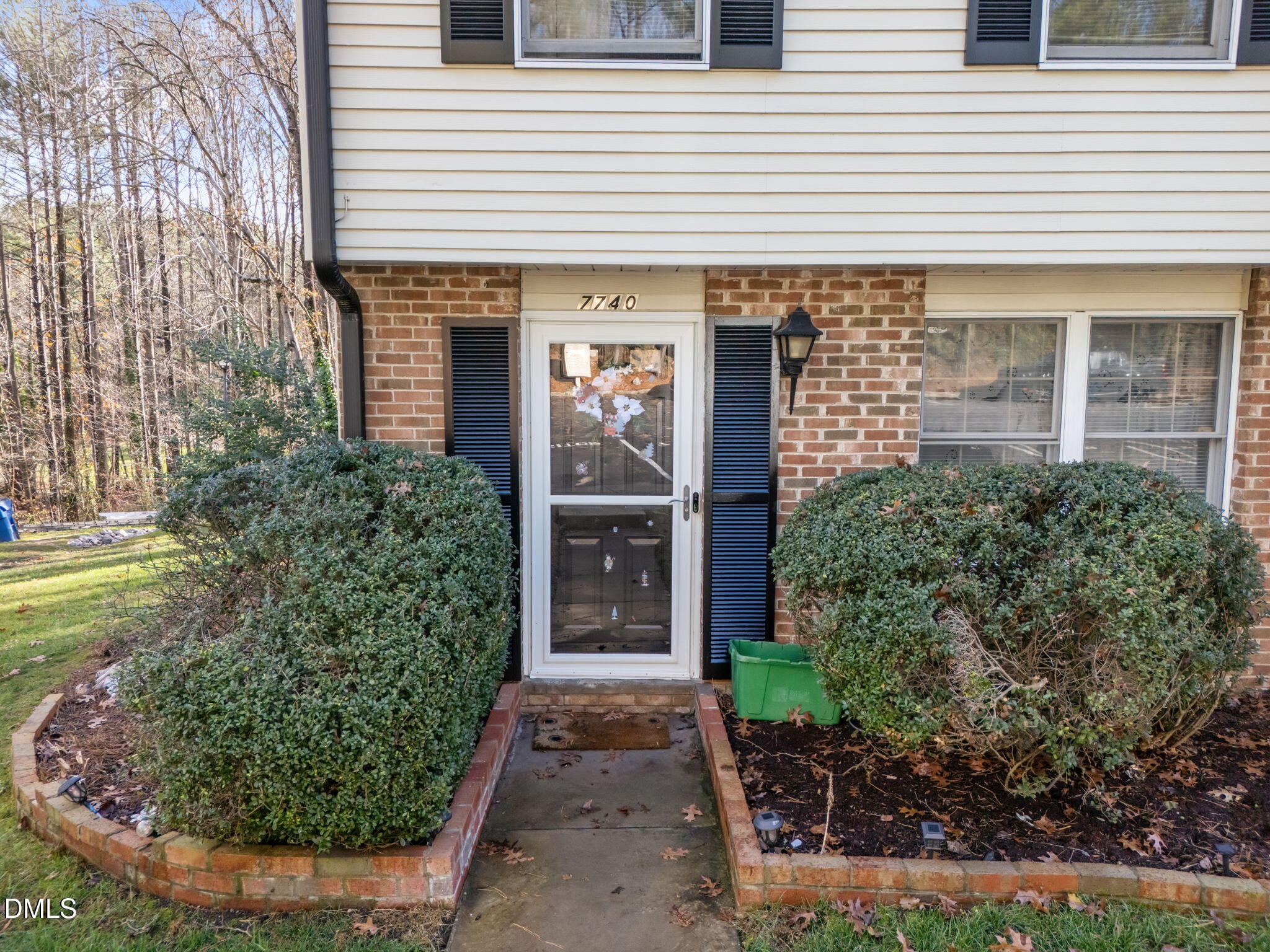 7740 Sandra Lane Raleigh, NC 27615 - Photo 4 of 36 a front view of a house with garden