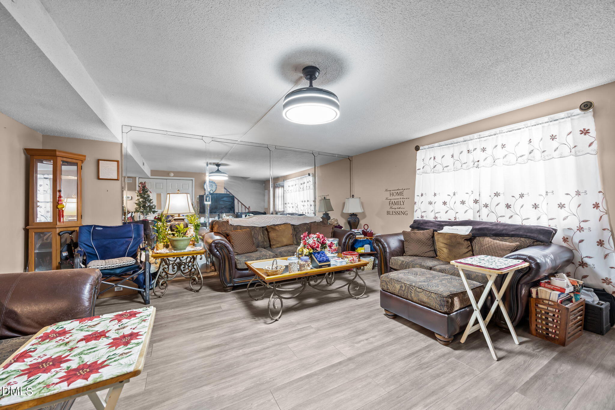 7740 Sandra Lane Raleigh, NC 27615 - Photo 10 of 36 a living room with furniture and wooden floor