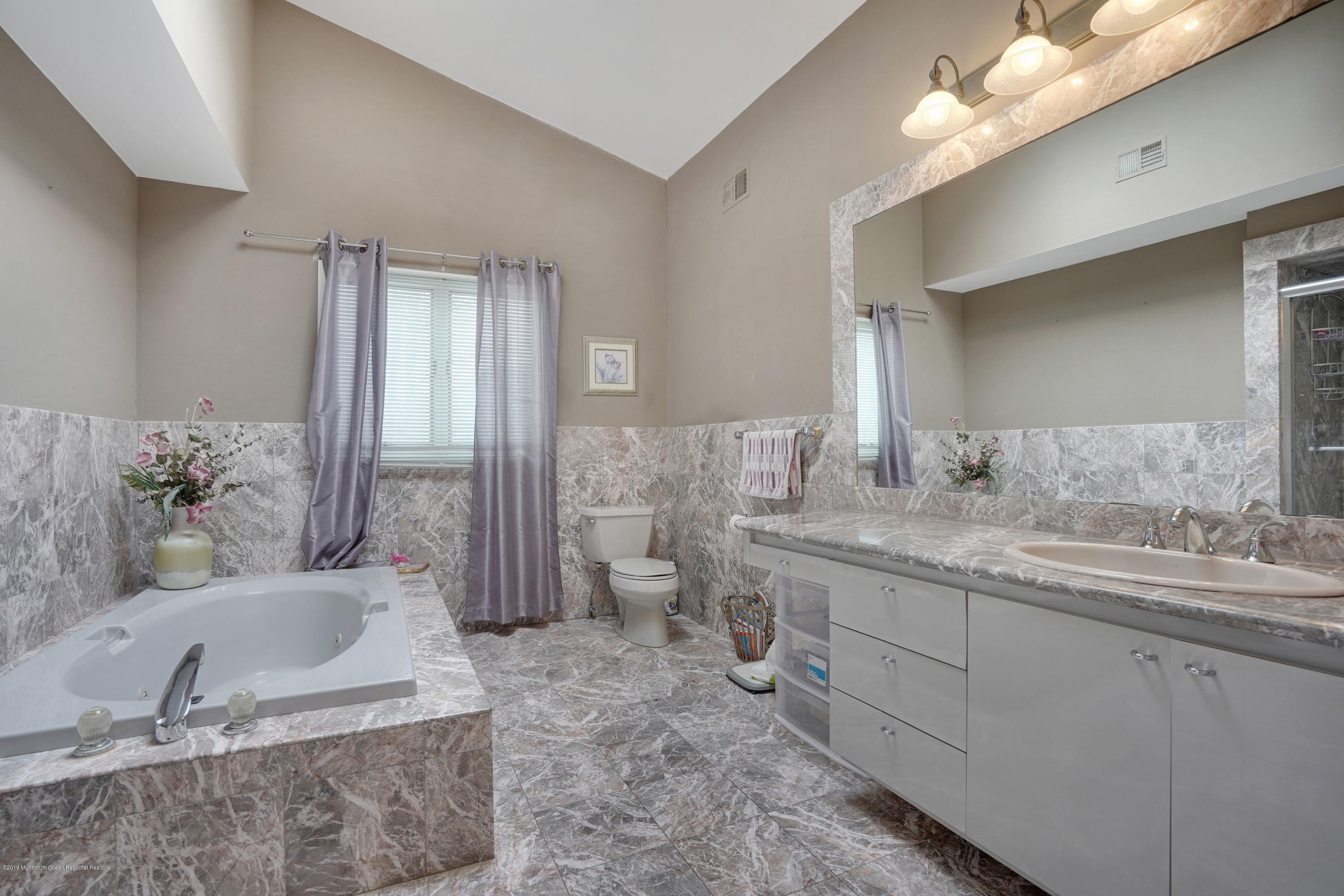 90 Georgetown Road Eatontown, NJ 07724 - Photo 12 of 18 a bathroom with a granite countertop sink and a large mirror