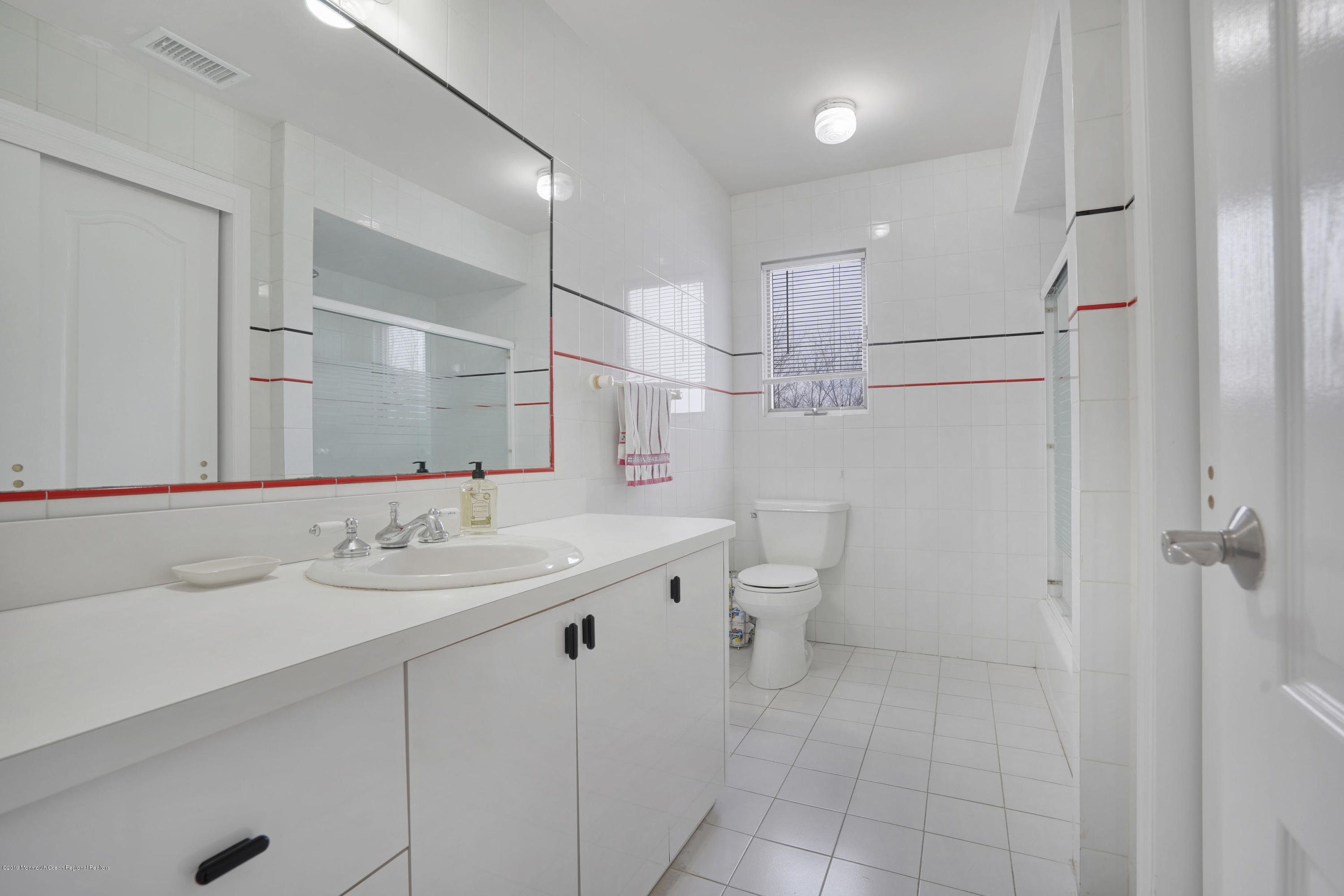 90 Georgetown Road Eatontown, NJ 07724 - Photo 14 of 18 a bathroom with a sink a toilet and shower