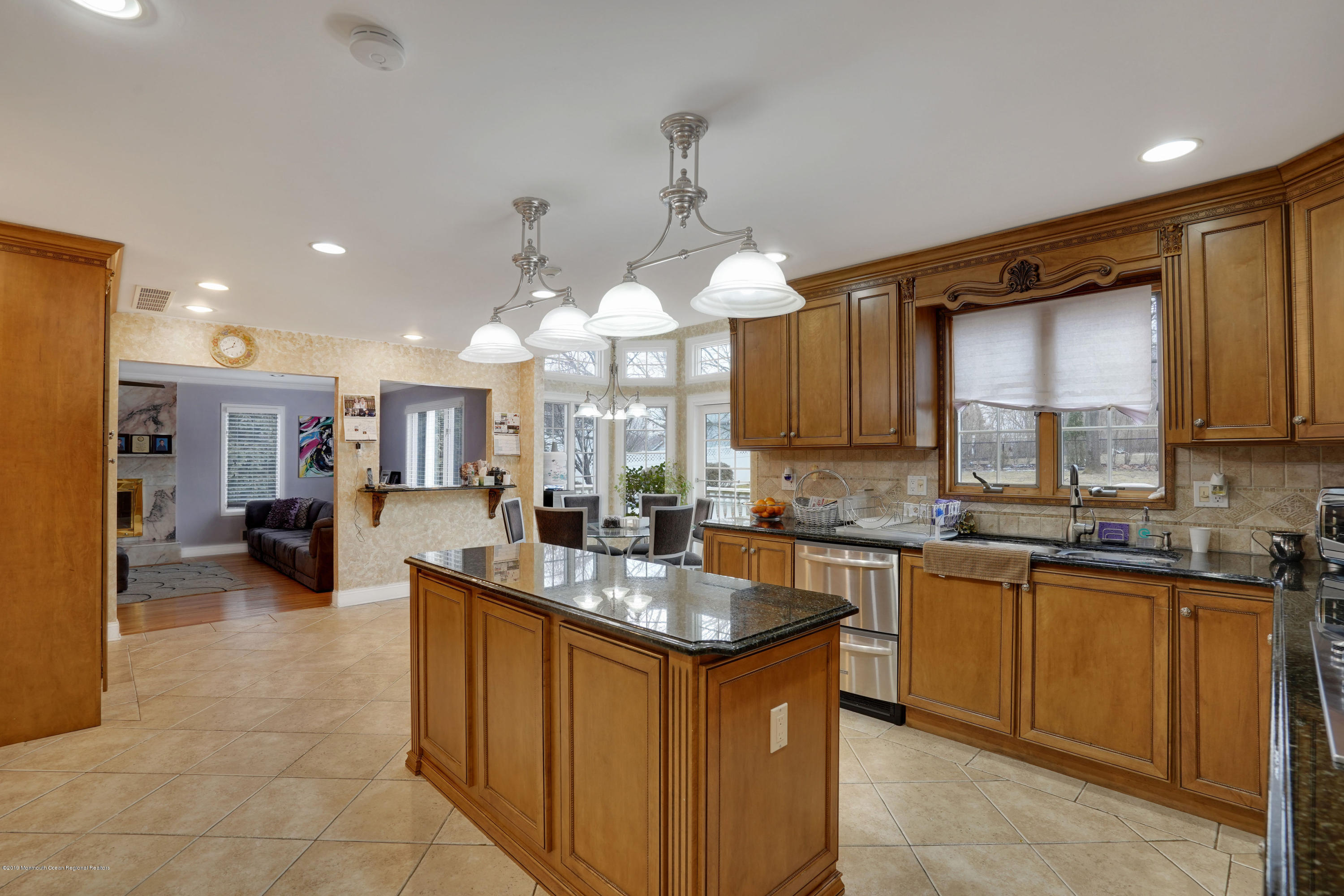 90 Georgetown Road Eatontown, NJ 07724 - Photo 9 of 18 a kitchen with kitchen island granite countertop a sink counter top space appliances and cabinets