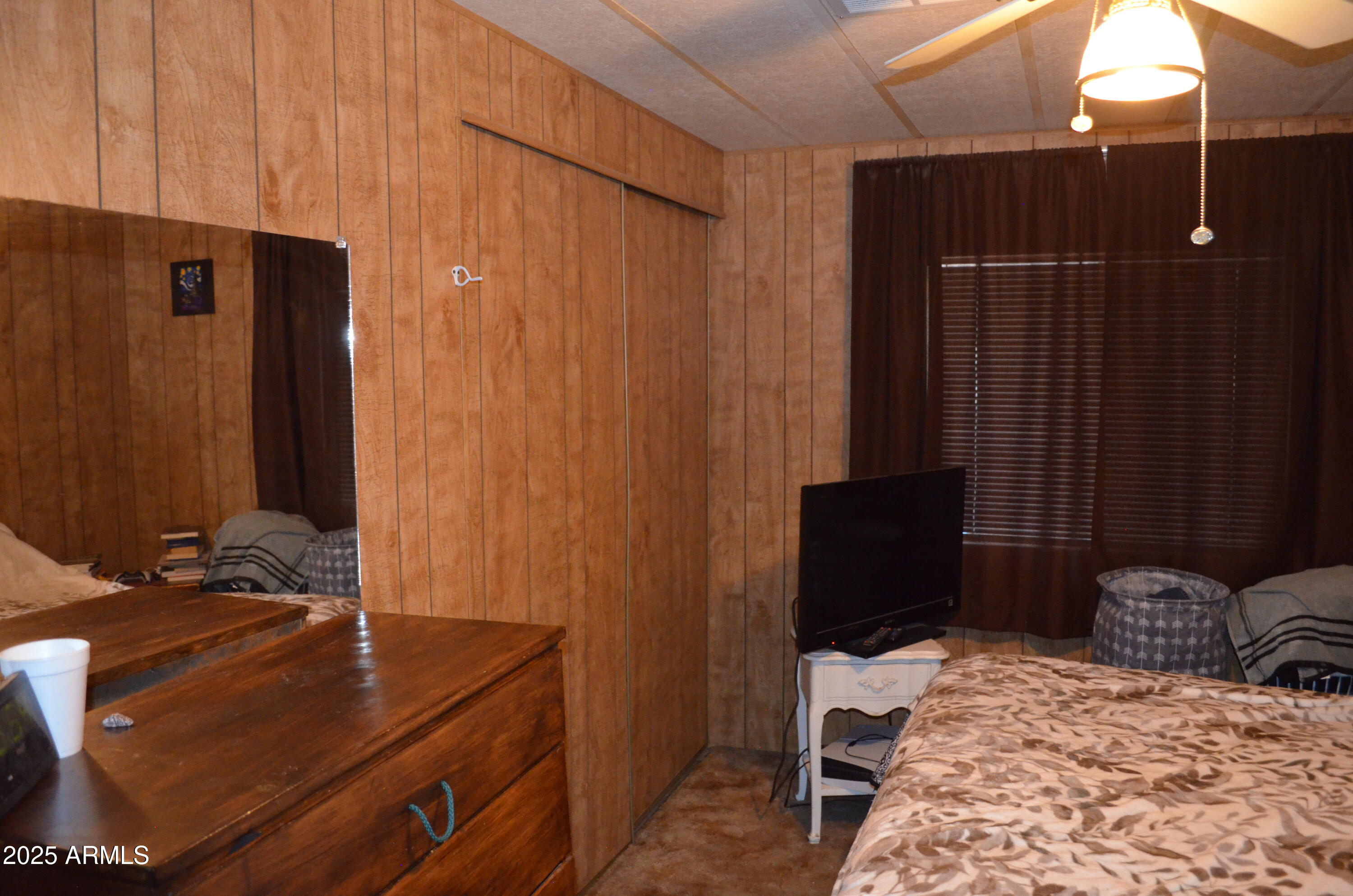 318 South Crismon Road, Unit 24 Mesa, AZ 85208 - Photo 15 of 23 a room with a bed and a dresser
