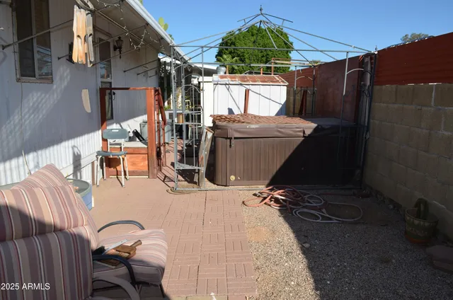a view of balcony with wooden floor and outdoor seating