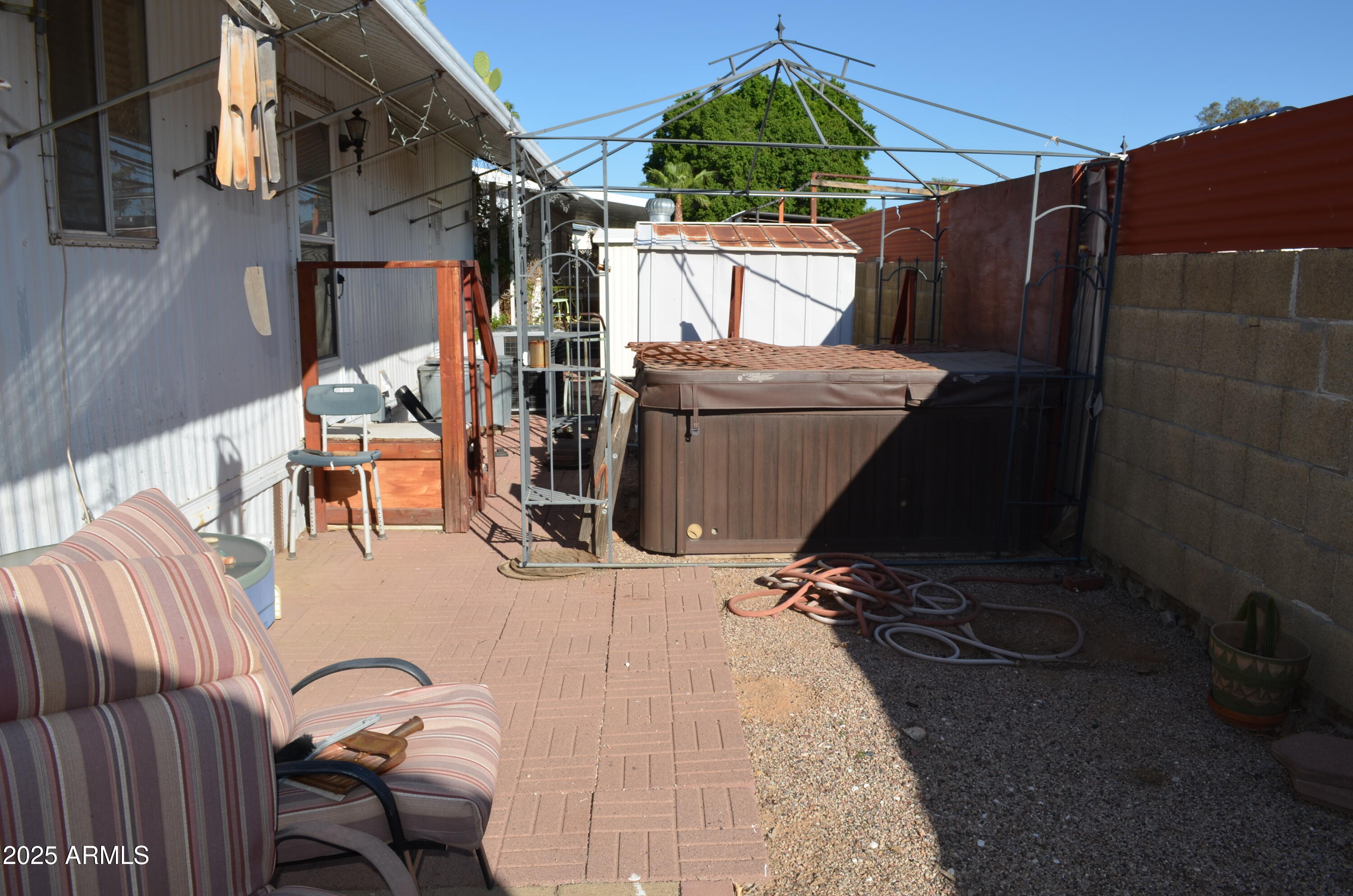 318 South Crismon Road, Unit 24 Mesa, AZ 85208 - Photo 19 of 23 a view of balcony with wooden floor and outdoor seating