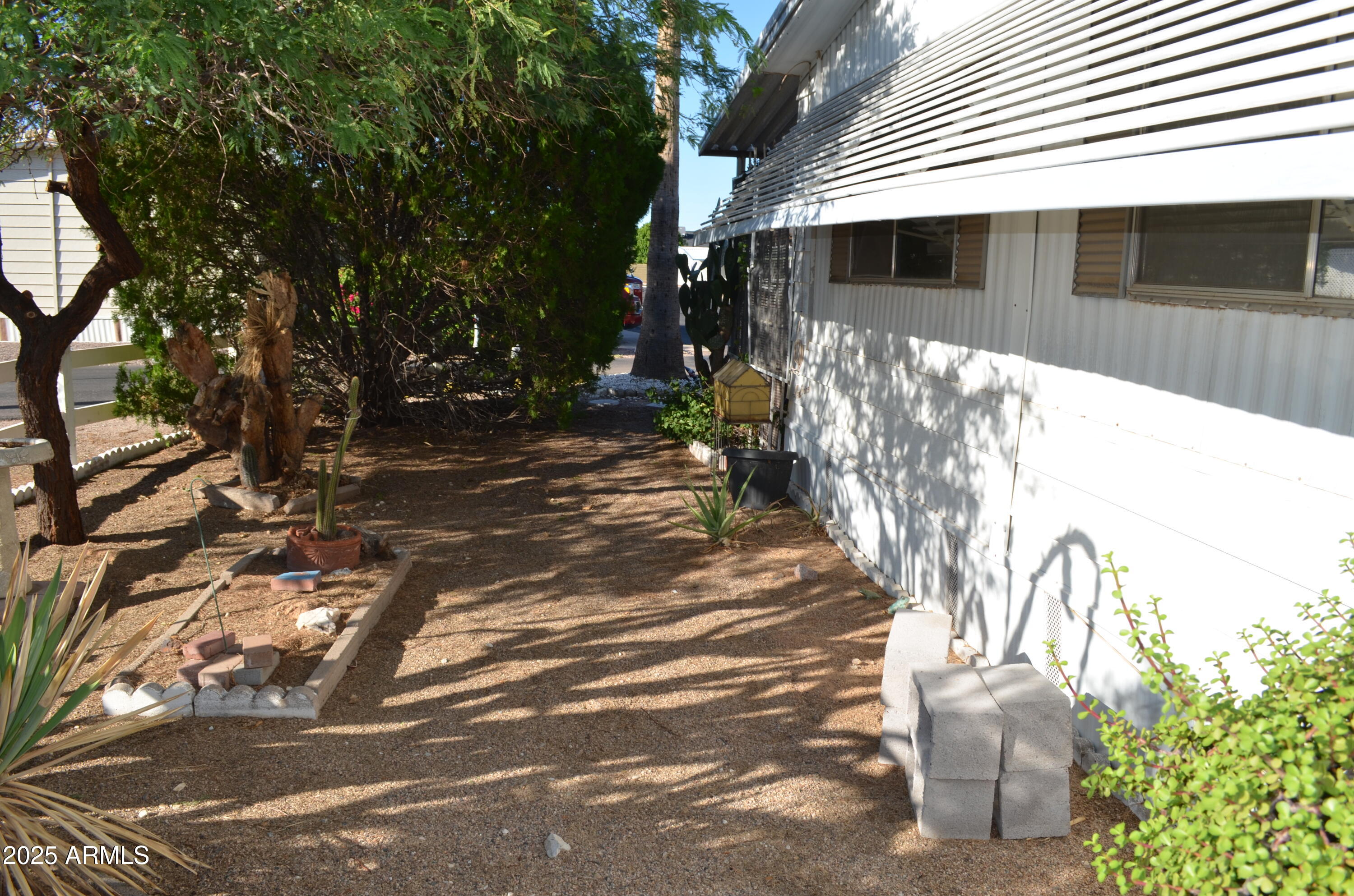 318 South Crismon Road, Unit 24 Mesa, AZ 85208 - Photo 20 of 23 a front view of a house with a yard