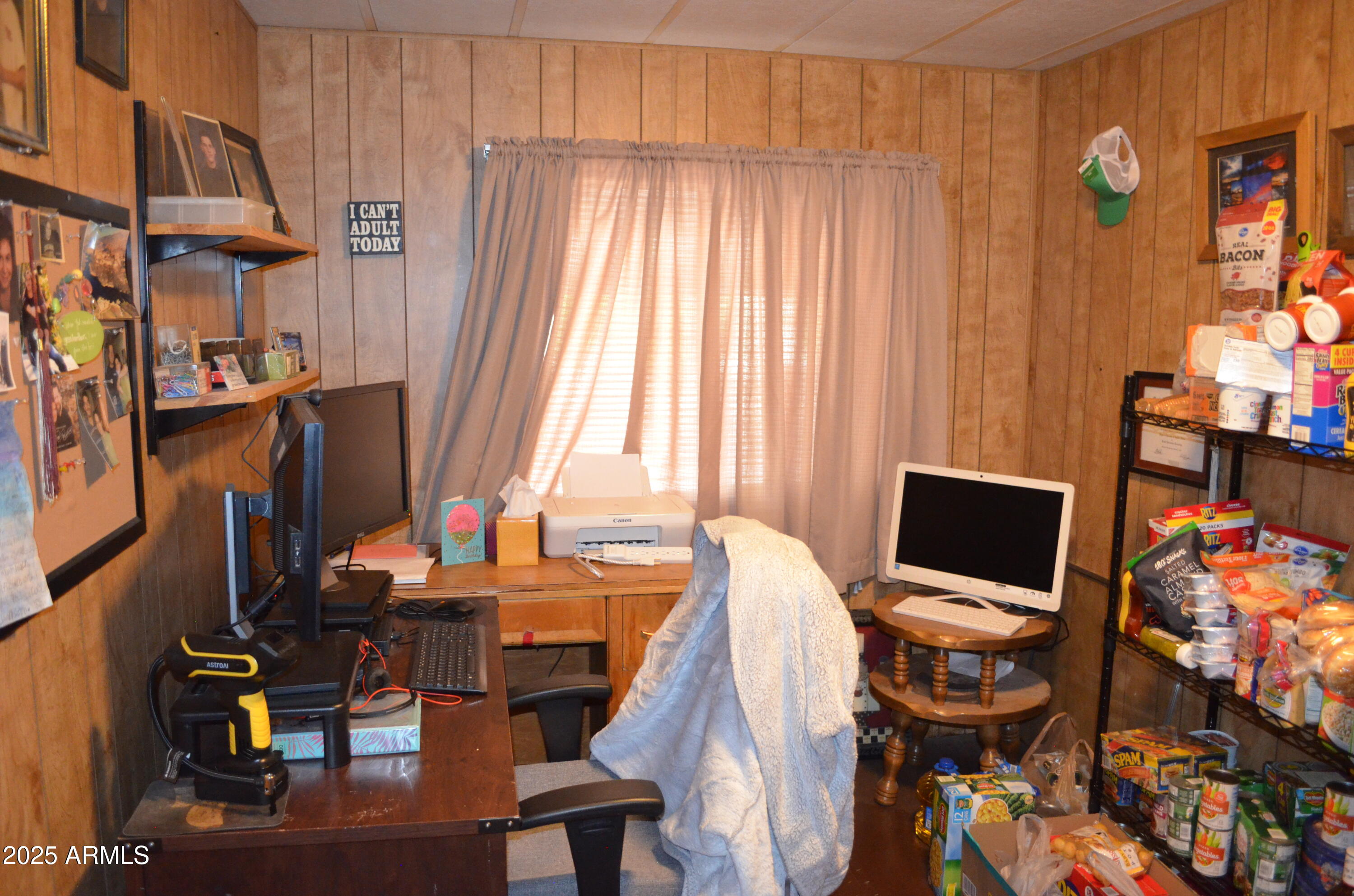 318 South Crismon Road, Unit 24 Mesa, AZ 85208 - Photo 3 of 23 a view of a workspace with furniture and a window