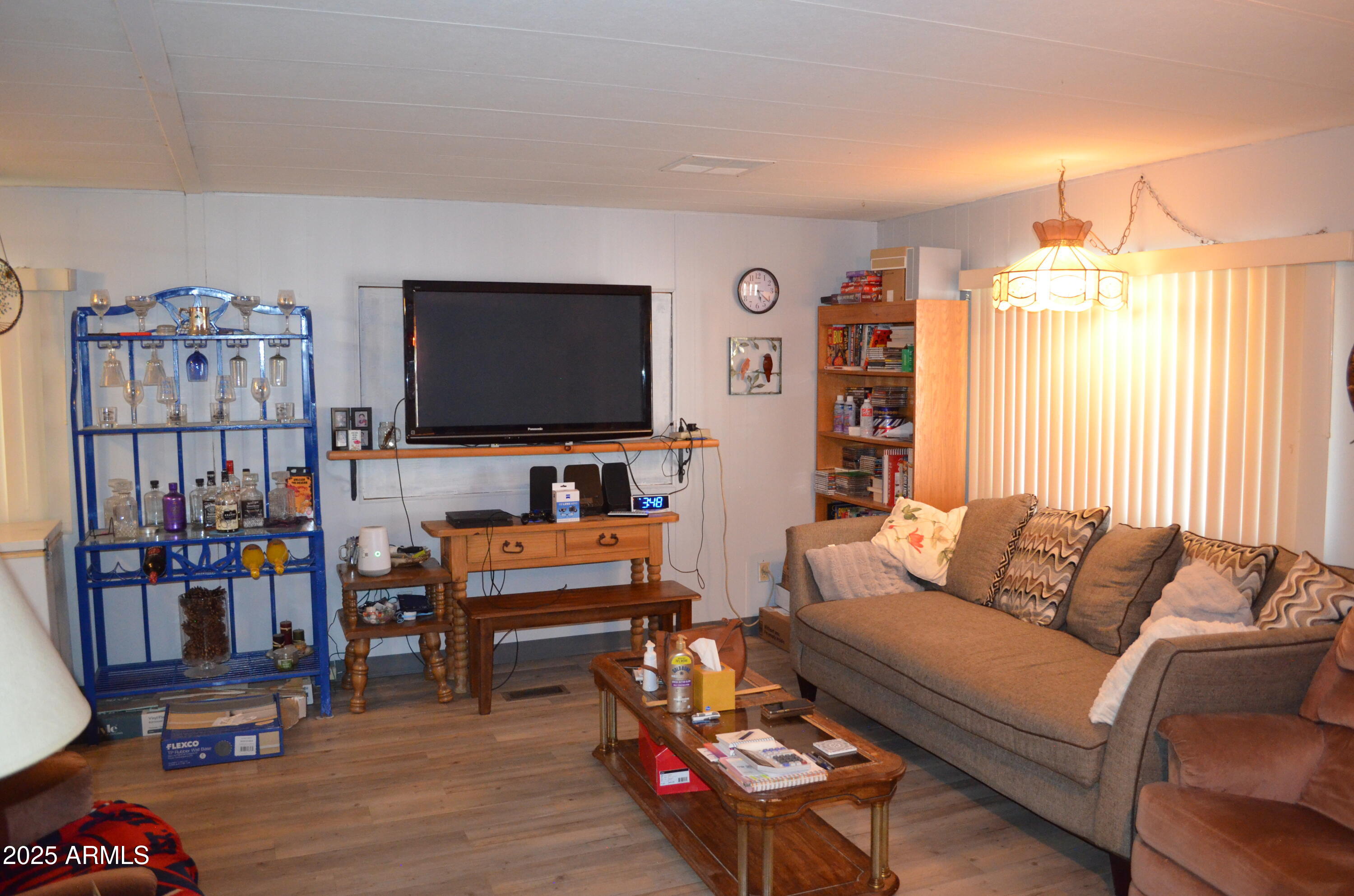 318 South Crismon Road, Unit 24 Mesa, AZ 85208 - Photo 5 of 23 a living room with furniture and a flat screen tv