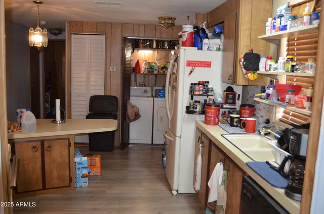 a view of dining room with refrigerator and furniture