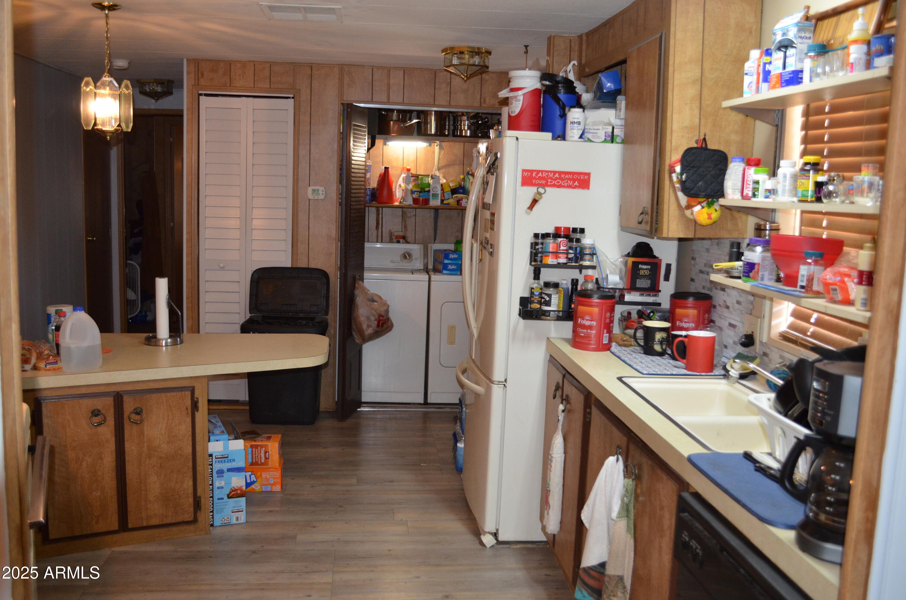 318 South Crismon Road, Unit 24 Mesa, AZ 85208 - Photo 7 of 23 a view of dining room with refrigerator and furniture