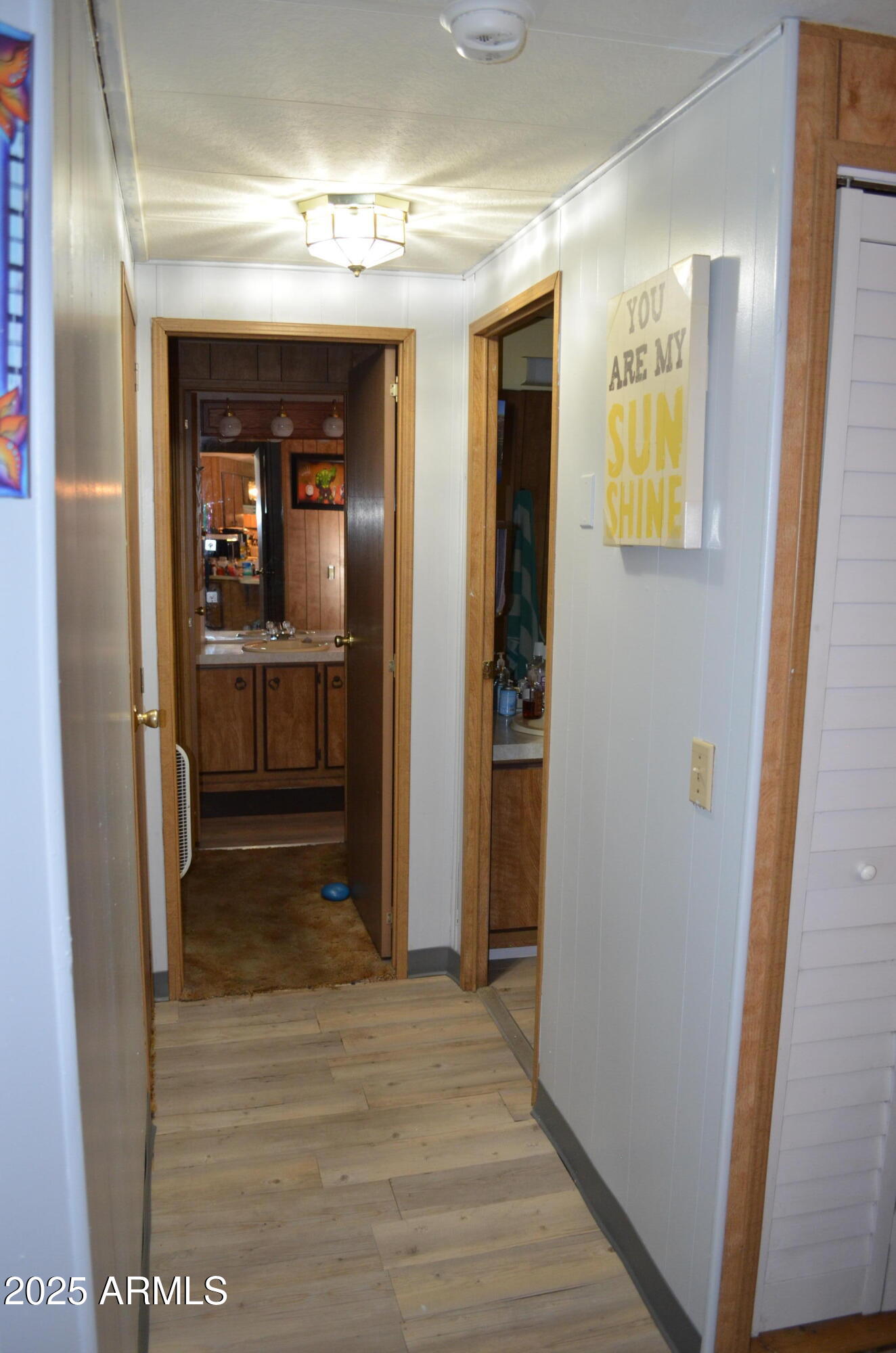 318 South Crismon Road, Unit 24 Mesa, AZ 85208 - Photo 10 of 23 a view of a hallway view with wooden floor and living room