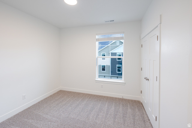 4661 Poplar Way, Unit R303 Mapleton, UT 84664 - Photo 7 of 17 Unfurnished bedroom featuring light carpet and baseboards