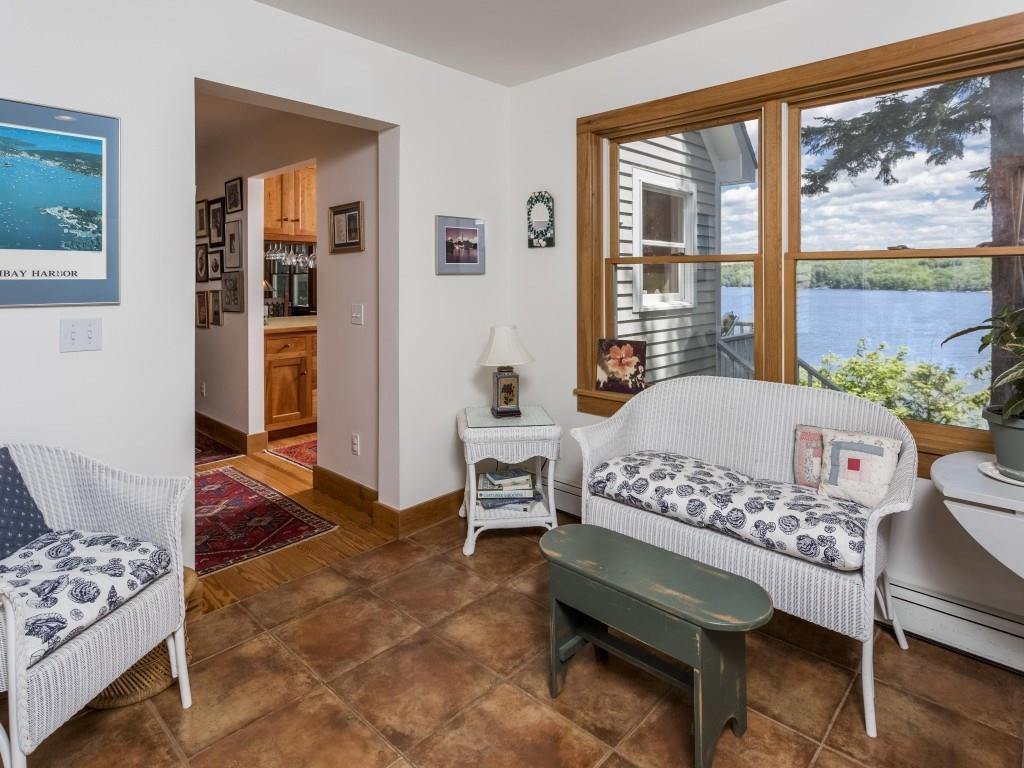 189 Steves Road Boothbay, ME 04537 - Photo 21 of 35 The sunroom with garage access and...
