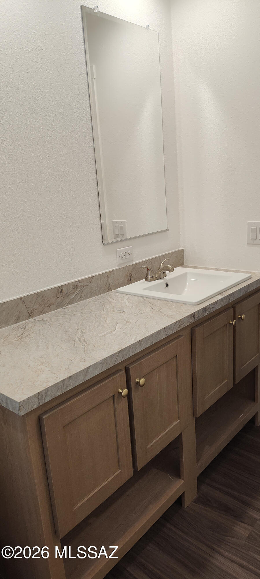18565 West McClean Road Marana, AZ 85653 - Photo 29 of 37 a bathroom with a sink and a mirror