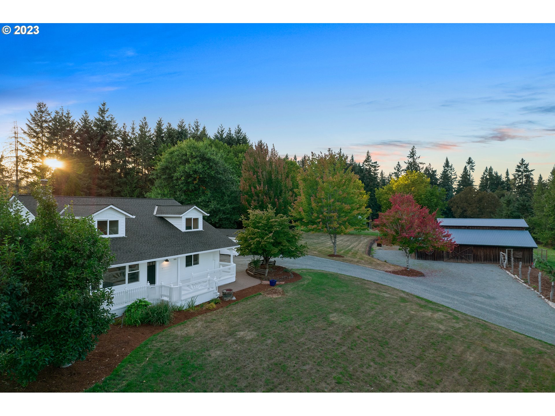 23918 Northwest Meuller Road Ridgefield, WA 98642 - Photo 1 of 32 a view of a house with a garden and a yard