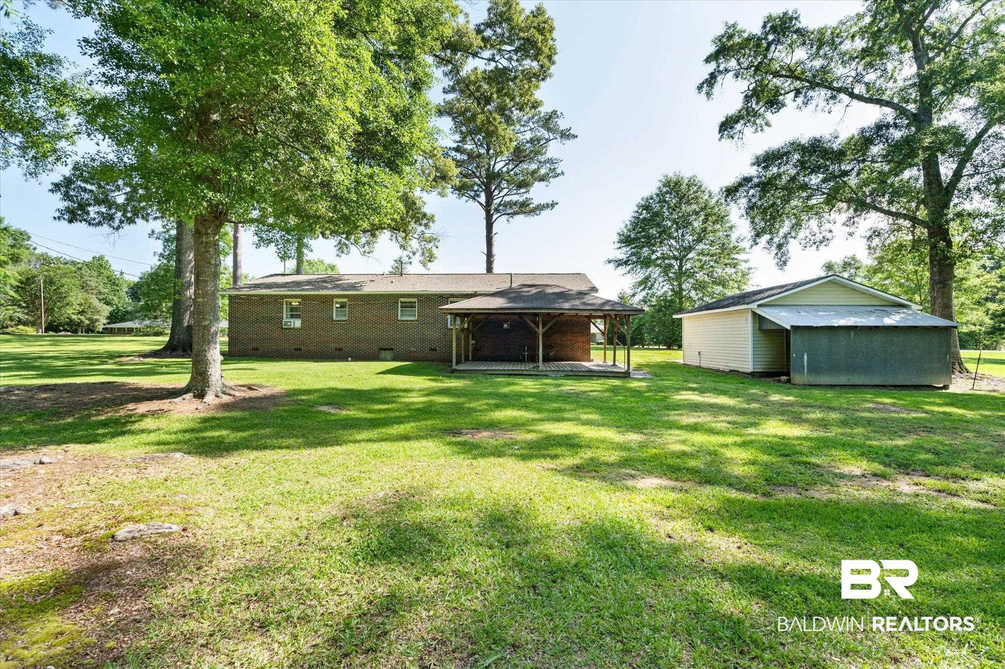 427 Upper Ferry Road Leroy, AL 36548 - Photo 16 of 37 View of green lawn featuring a gazebo and an outbuilding