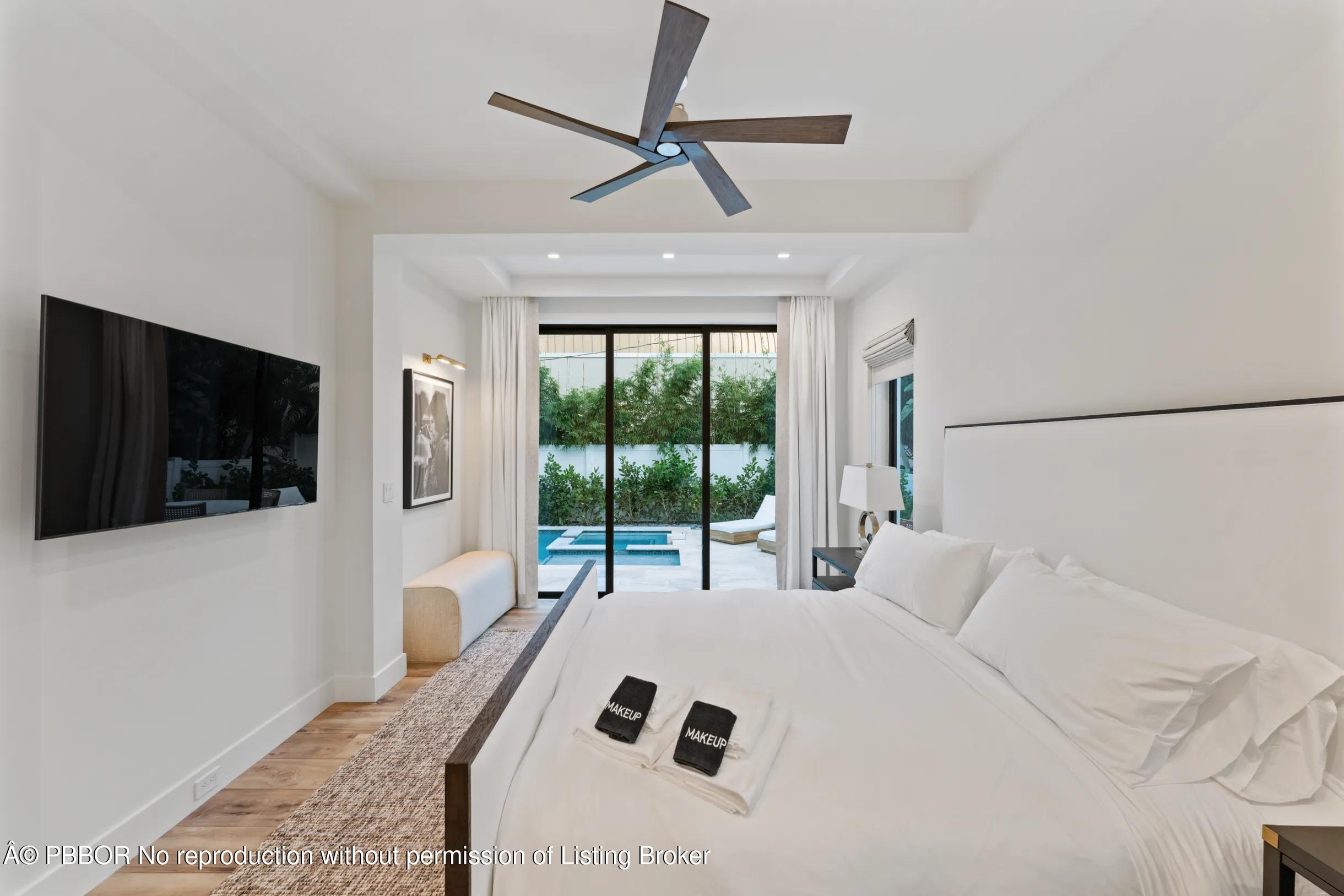 Undisclosed Address West Palm Beach, FL 33407 - Photo 19 of 57 a bedroom with a bed and a flat screen tv