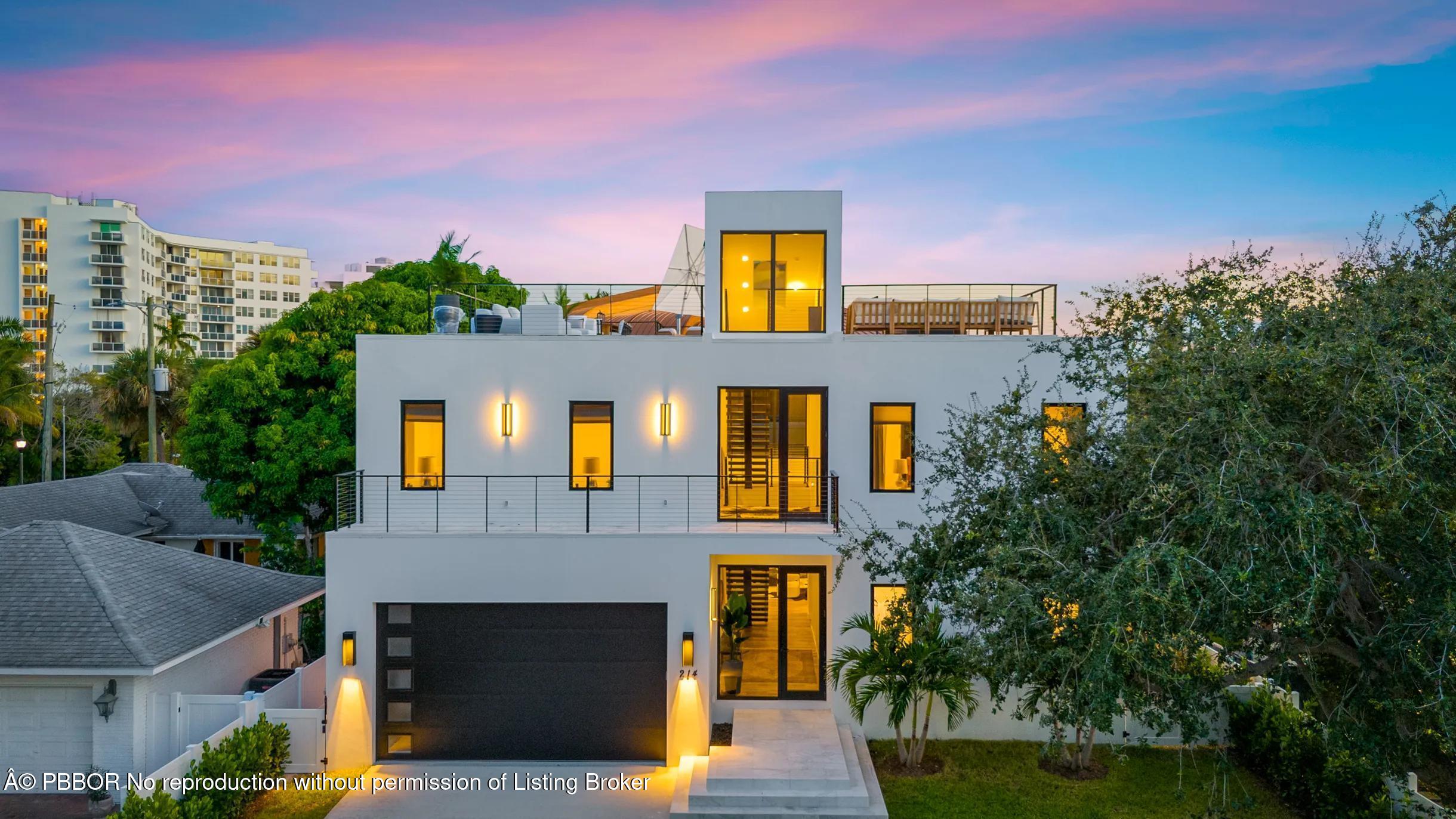 Undisclosed Address West Palm Beach, FL 33407 - Photo 2 of 57 a front view of a house with a yard