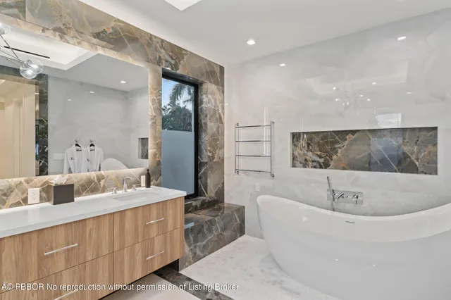 a bathroom with a granite countertop sink a shower and a mirror