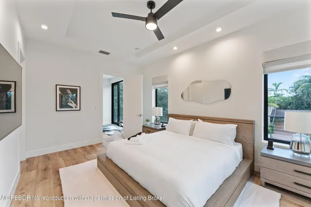 a large white bed in a white room