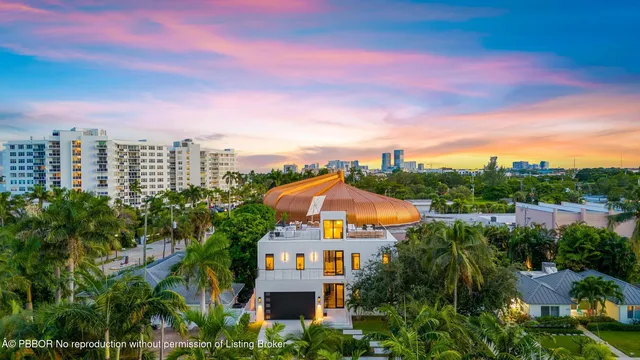 a view of a city with tall buildings and a yard