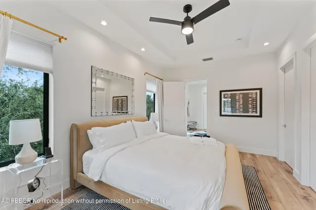 a bed room with a bed and a lamp