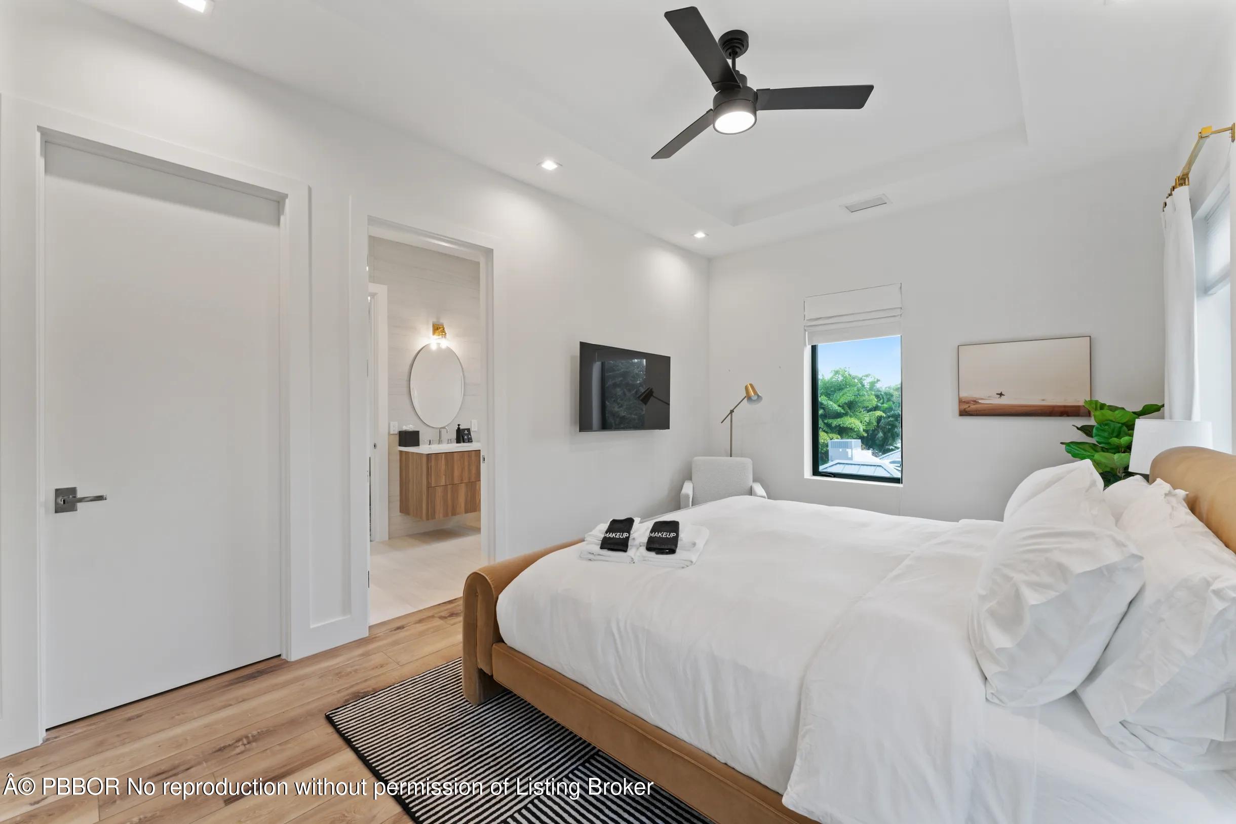 Undisclosed Address West Palm Beach, FL 33407 - Photo 35 of 57 a bedroom with a bed and a flat screen tv