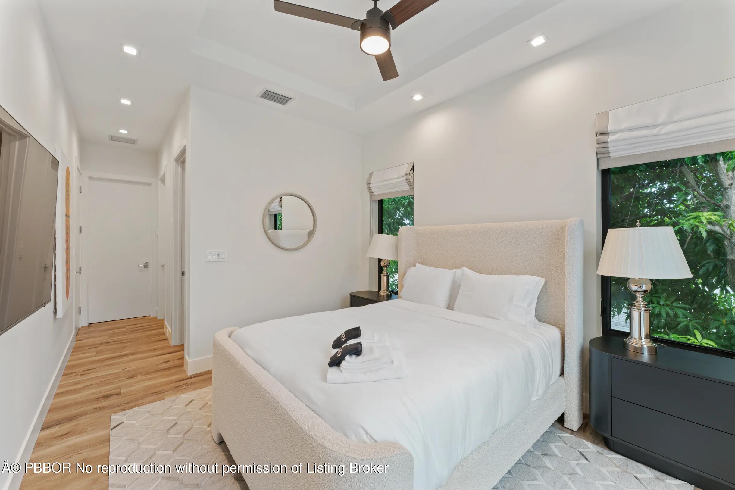 Undisclosed Address West Palm Beach, FL 33407 - Photo 38 of 57 a bed room with a bed and a lamp