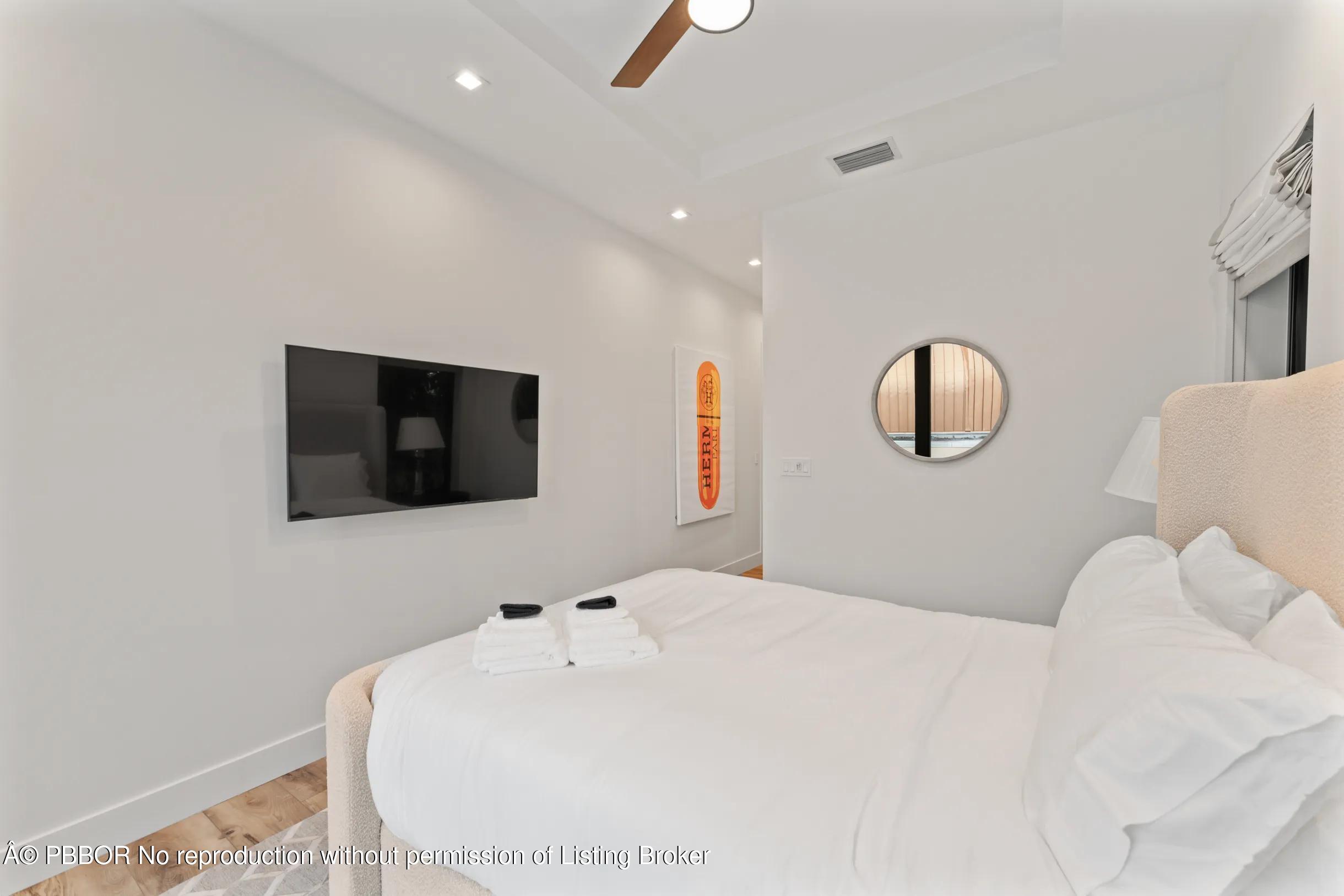 Undisclosed Address West Palm Beach, FL 33407 - Photo 39 of 57 a bedroom with a bed and a flat screen tv