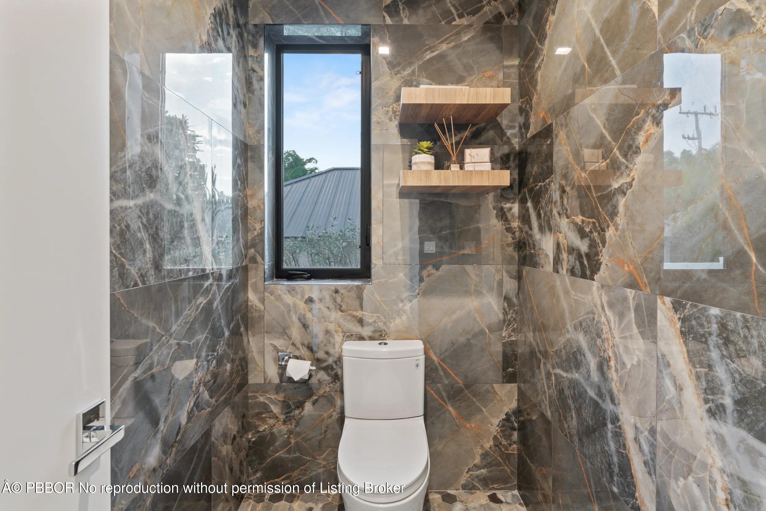 Undisclosed Address West Palm Beach, FL 33407 - Photo 41 of 57 a bathroom with a toilet and a shower