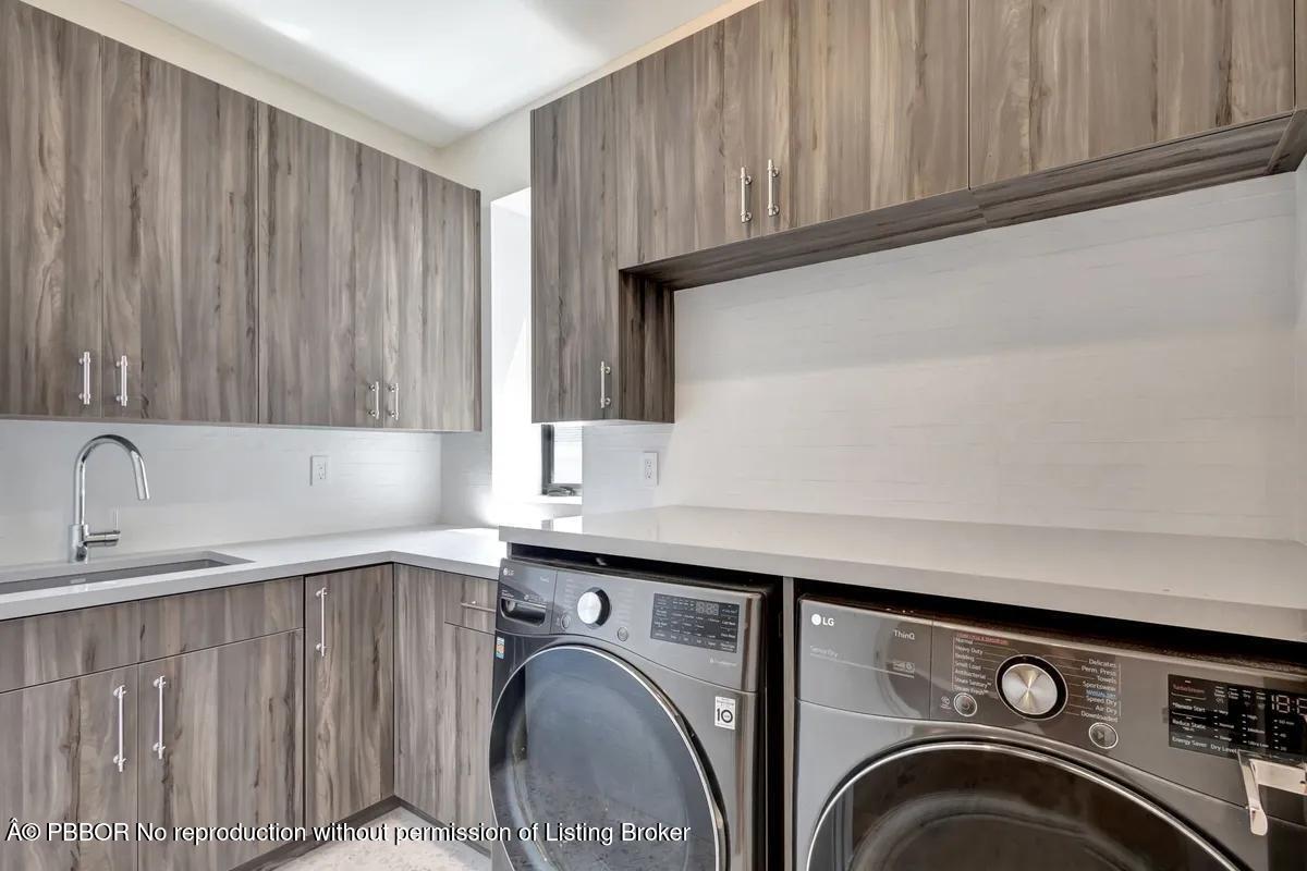 Undisclosed Address West Palm Beach, FL 33407 - Photo 49 of 57 a utility room with dryer and washer