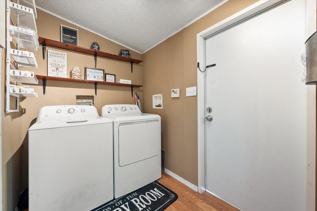 309 Southeast County Road Corsicana, TX 75109 - Photo 22 of 27 Dedicated laundry area featuring wood-finish flooring