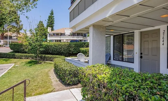 a view of balcony with chairs and table