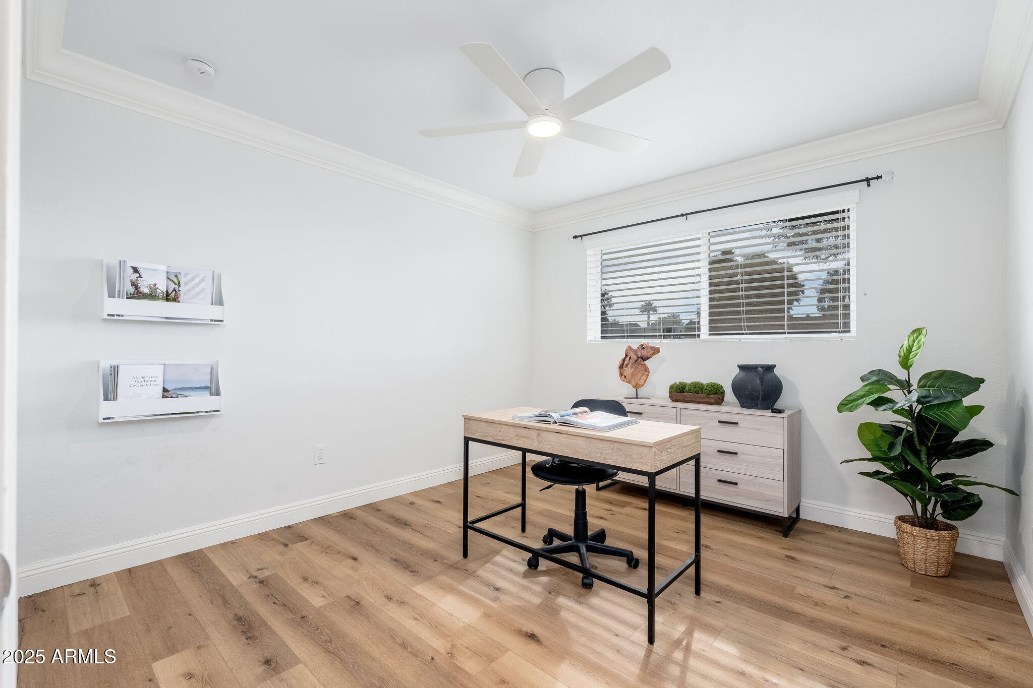 3002 East Whitton Avenue Phoenix, AZ 85016 - Photo 10 of 32 a view of a workspace with furniture and a potted plant