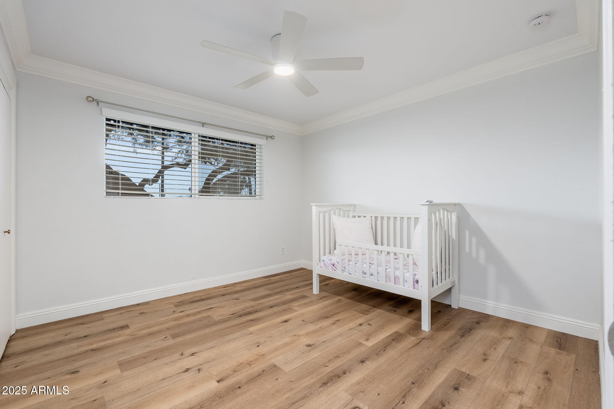 3002 East Whitton Avenue Phoenix, AZ 85016 - Photo 11 of 32 a view of wooden floor and windows in a room