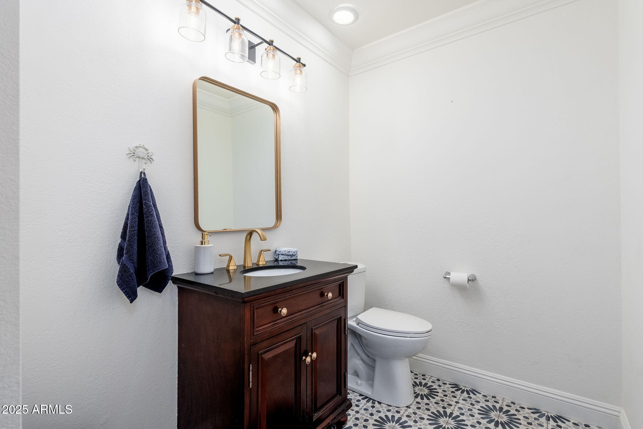 3002 East Whitton Avenue Phoenix, AZ 85016 - Photo 24 of 32 a bathroom with a toilet sink and mirror