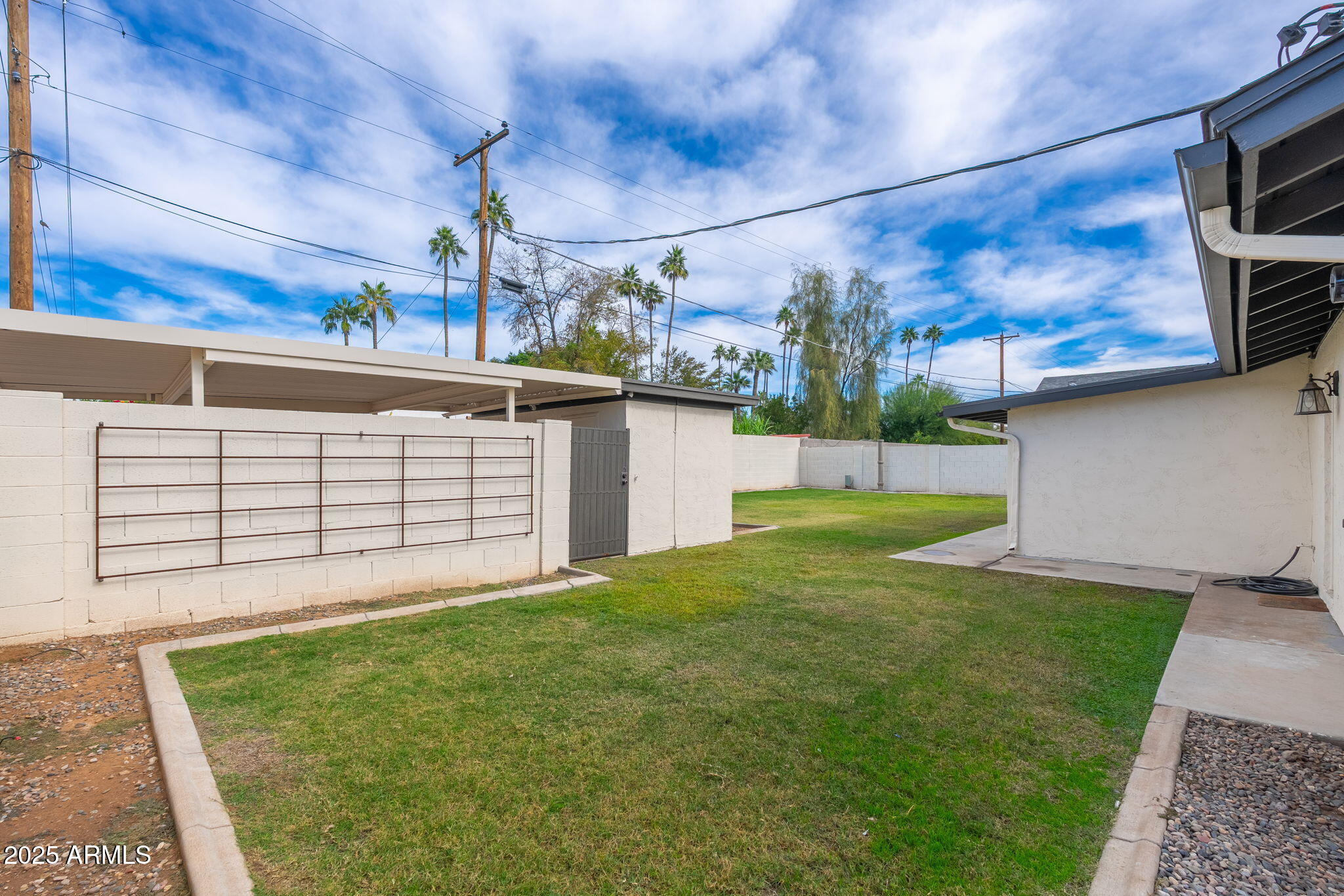 3002 East Whitton Avenue Phoenix, AZ 85016 - Photo 29 of 32 a view of a white house next to a yard